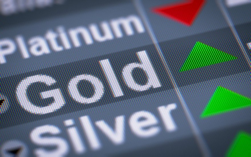 A precious metals investing screen with red and green arrows.